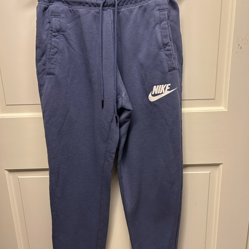Navy blue Nike joggers cuffed